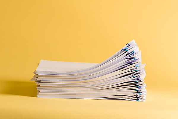 Pile of papers organized with paper clips